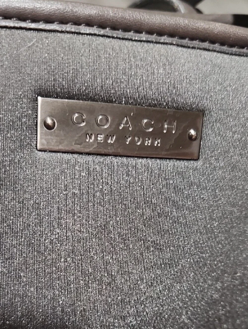 Coach sleek dark